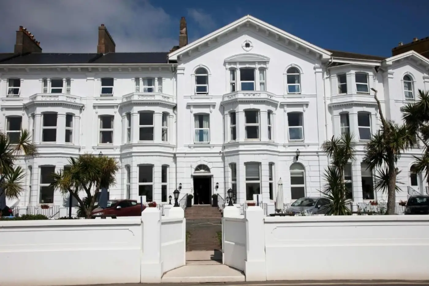 Exmouth Beach Hotel exterior - white Victorian seafront building on Morton Crescent